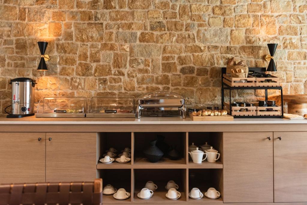 Kuchyň nebo kuchyňský kout v ubytování Revi Mountain Resort Boutique Hotel