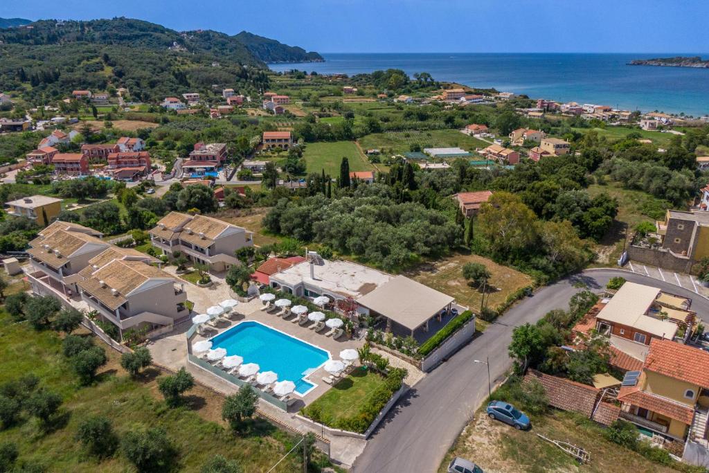 an aerial view of a villa with a swimming pool at Anna Studio and Maisonettes in Arillas