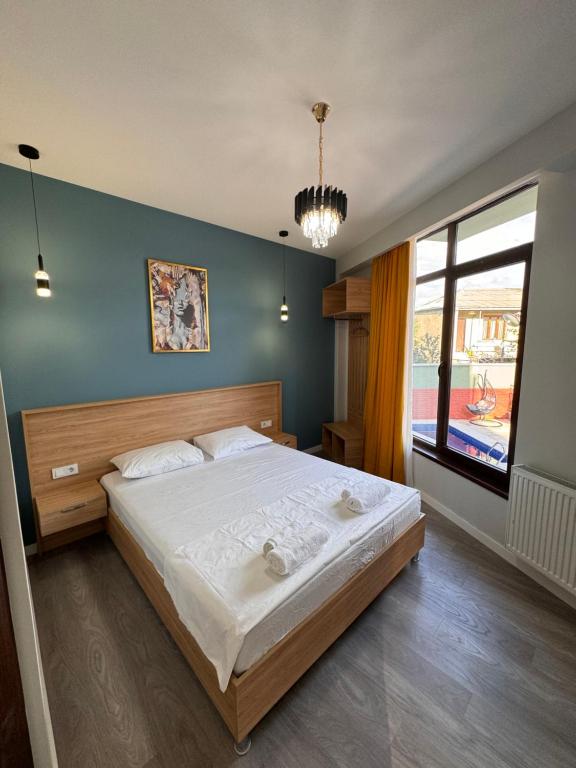 Postel nebo postele na pokoji v ubytování Hotel Boutique Adam