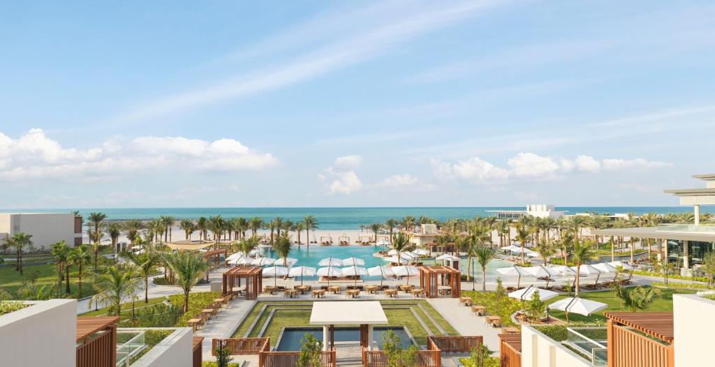 an aerial view of a resort with a pool and the ocean at InterContinental Ras Al Khaimah Mina Al Arab Resort & Spa, an IHG Hotel in Ras al Khaimah