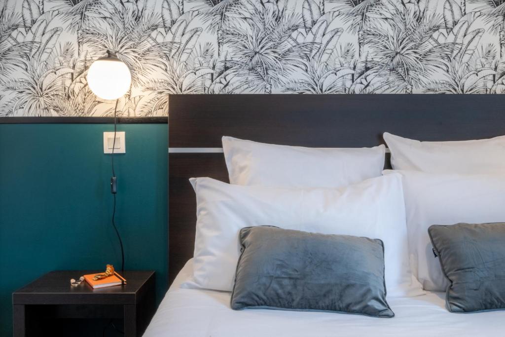 Postel nebo postele na pokoji v ubytování Nemea Appart Hotel Toulouse Aéroport