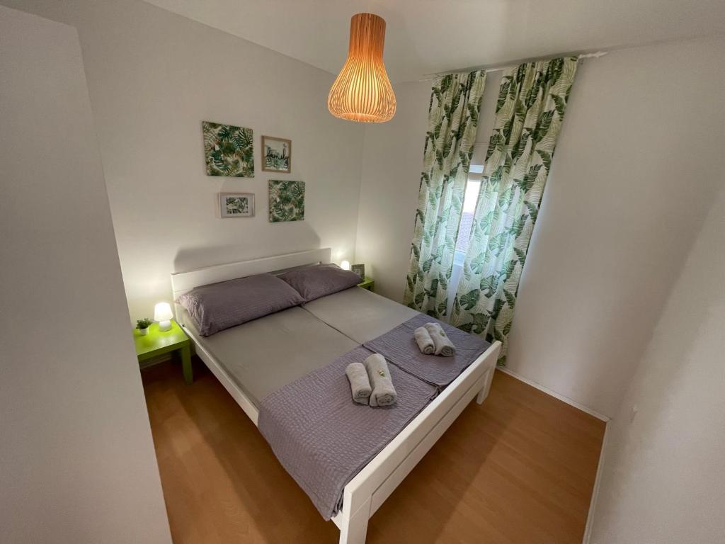 Posteľ alebo postele v izbe v ubytovaní Apartmenthouse Ines