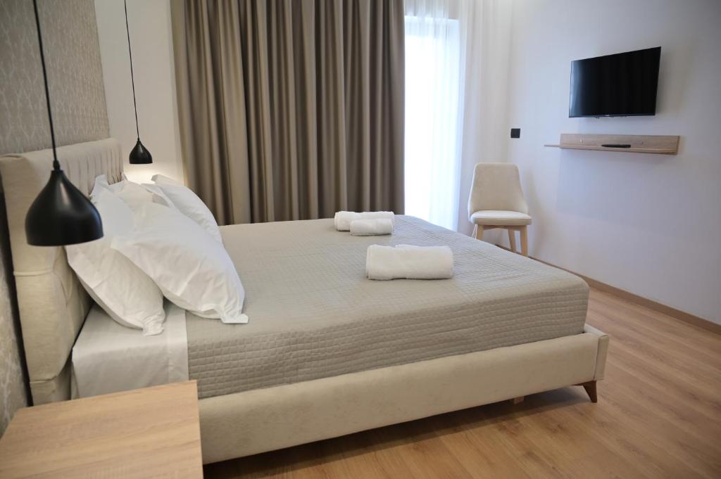 Postel nebo postele na pokoji v ubytování Villa Qeli