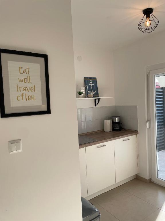 Kuchyňa alebo kuchynka v ubytovaní Apartmenthouse Ines