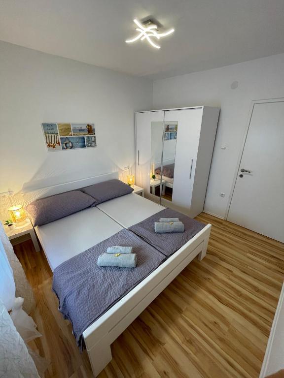 Posteľ alebo postele v izbe v ubytovaní Apartmenthouse Ines