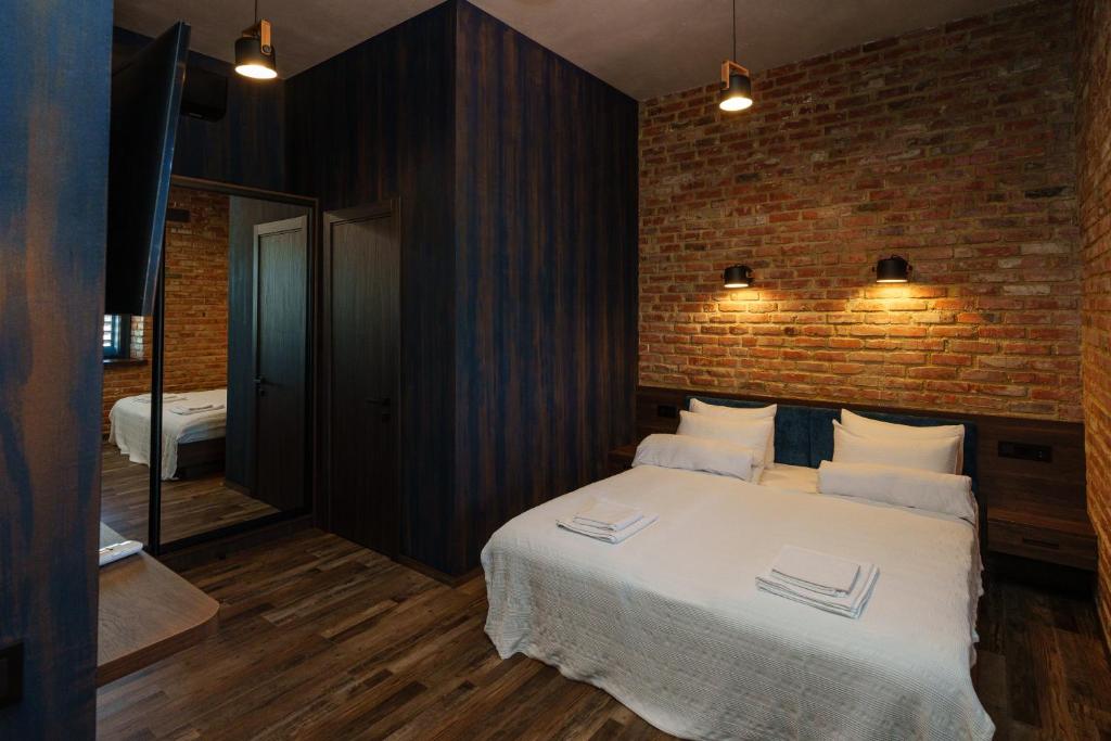 Postel nebo postele na pokoji v ubytování Palmira Hotel