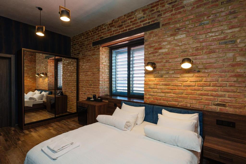 Postel nebo postele na pokoji v ubytování Palmira Hotel