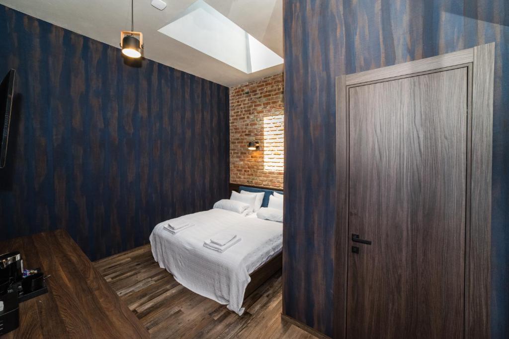 Postel nebo postele na pokoji v ubytování Palmira Hotel