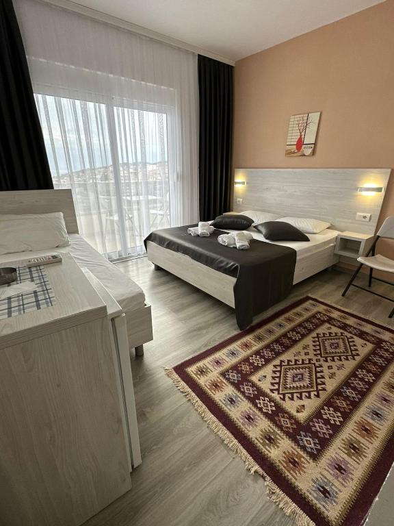 Postel nebo postele na pokoji v ubytování Molla Apartments