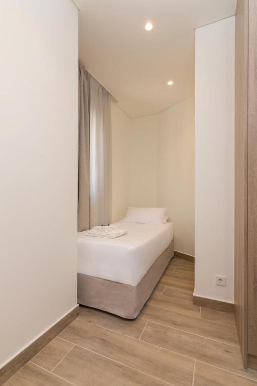 Postel nebo postele na pokoji v ubytování Socrates Fully Equipped Apartments with Unique Design