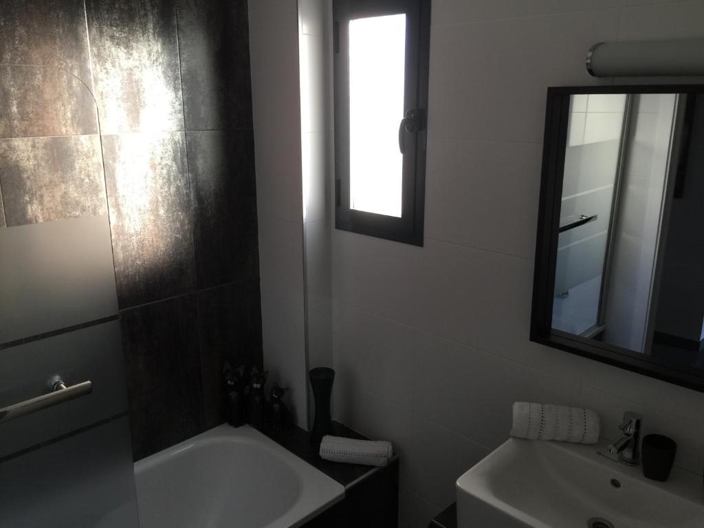 Koupelna v ubytování OasisBeach Penthousse la Zénia