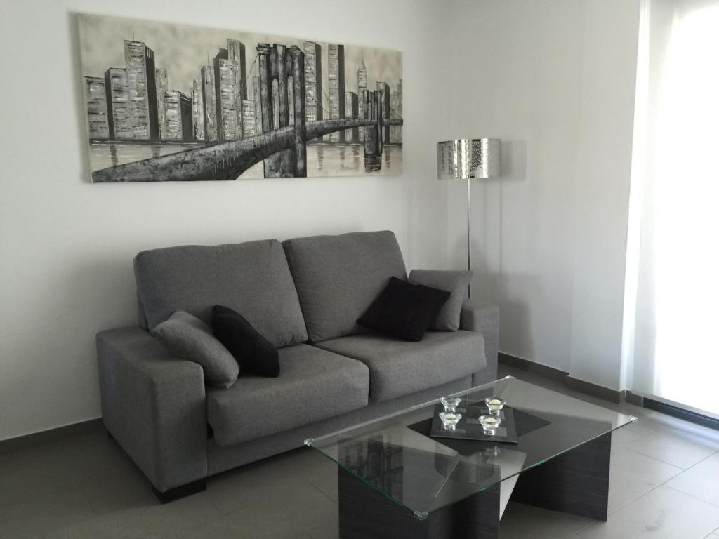Posezení v ubytování OasisBeach Penthousse la Zénia
