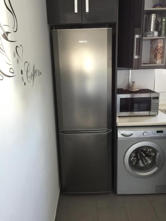 Kuchyň nebo kuchyňský kout v ubytování OasisBeach Penthousse la Zénia