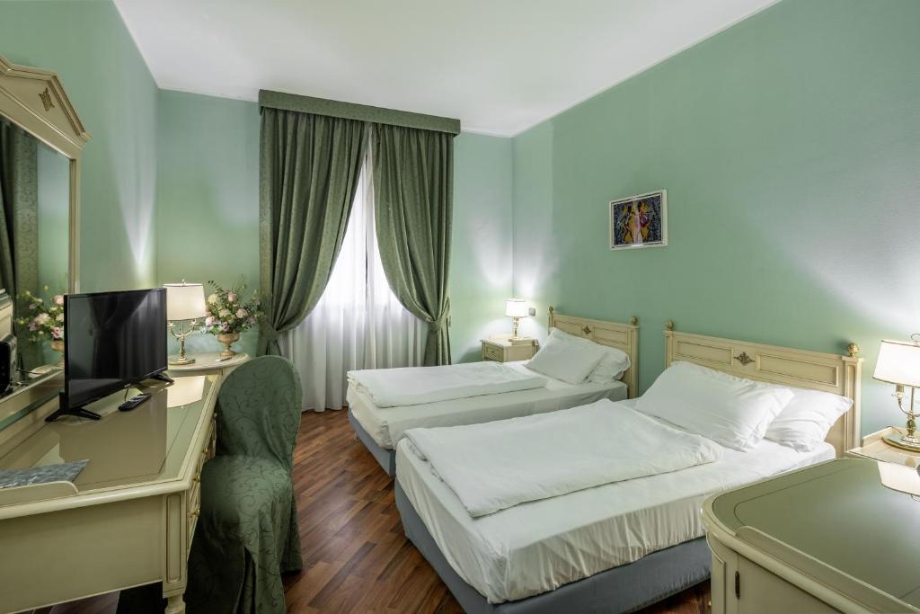 Posteľ alebo postele v izbe v ubytovaní Hotel Lucrezia Borgia