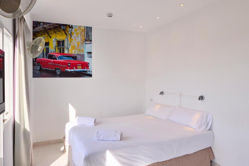 Cama ou camas em um quarto em Hostal Floridita Adults Only