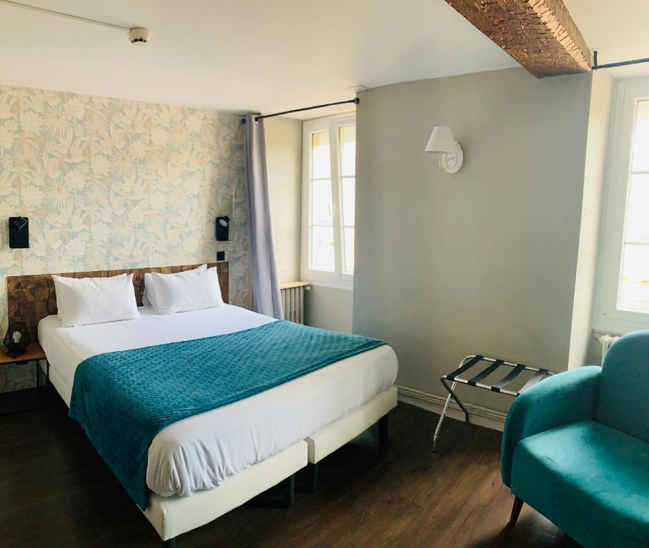 Postel nebo postele na pokoji v ubytování Hôtel du Roy