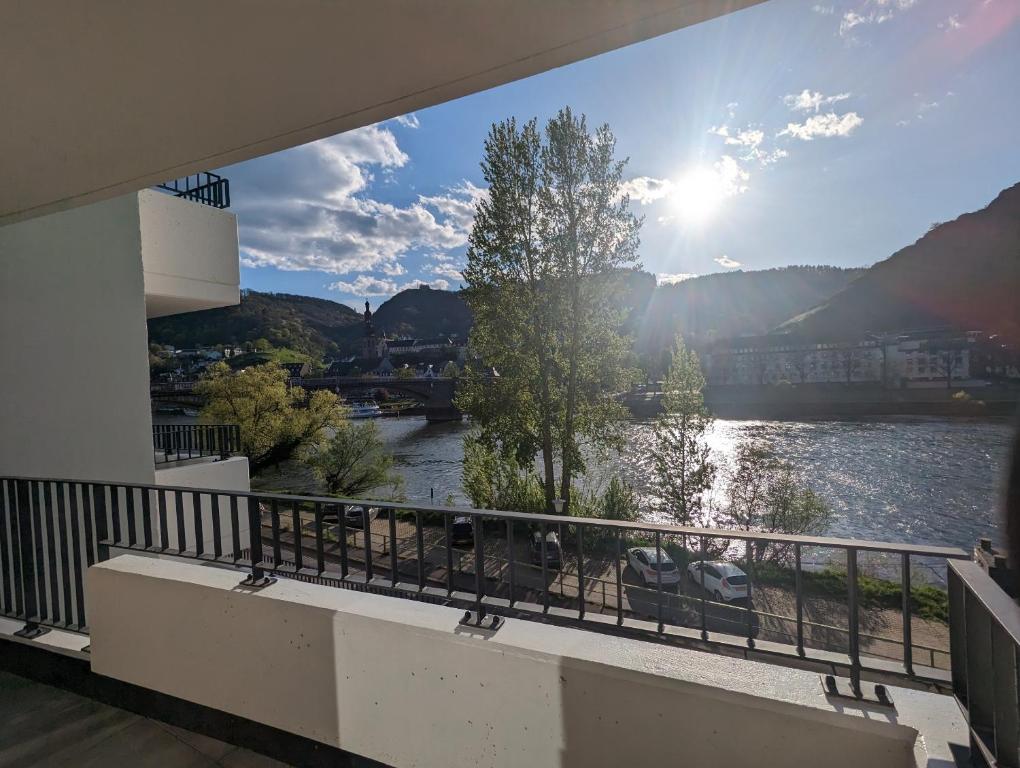 a balcony with a view of a river at Ferienwohnungen Heimkino Cochem in Cochem