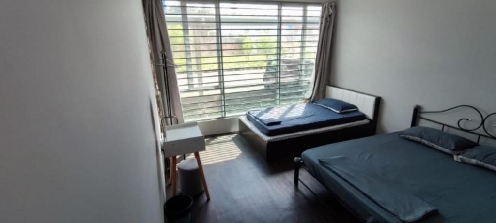 Postel nebo postele na pokoji v ubytování TAR HOMESTAY