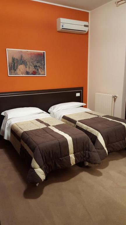 Ένα ή περισσότερα κρεβάτια σε δωμάτιο στο B&B Bed& Fly - Mamma Mia
