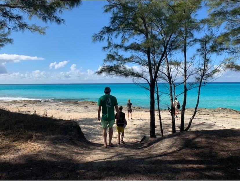 a man and a child walking on the beach at La casa de Pernilla Awesome apartment, near beach in centre of town in Puerto de Mazarrón