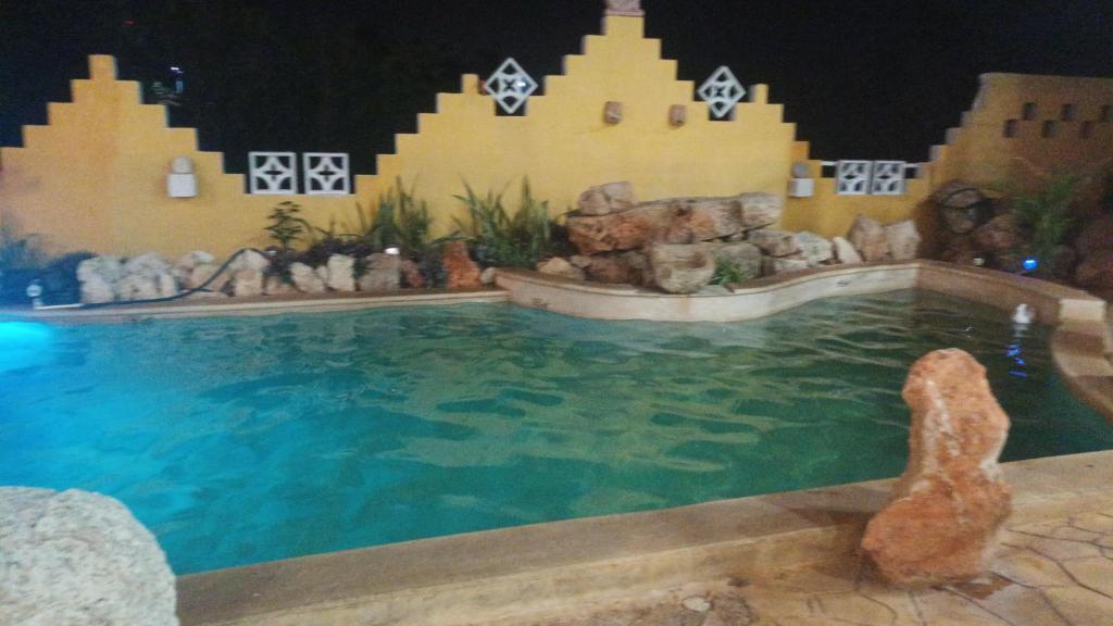 Bazén v ubytování Buenosdías Izamal nebo v jeho okolí