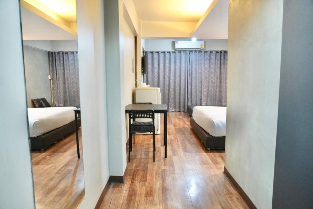 Postel nebo postele na pokoji v ubytování Bkk39 Airport hotel