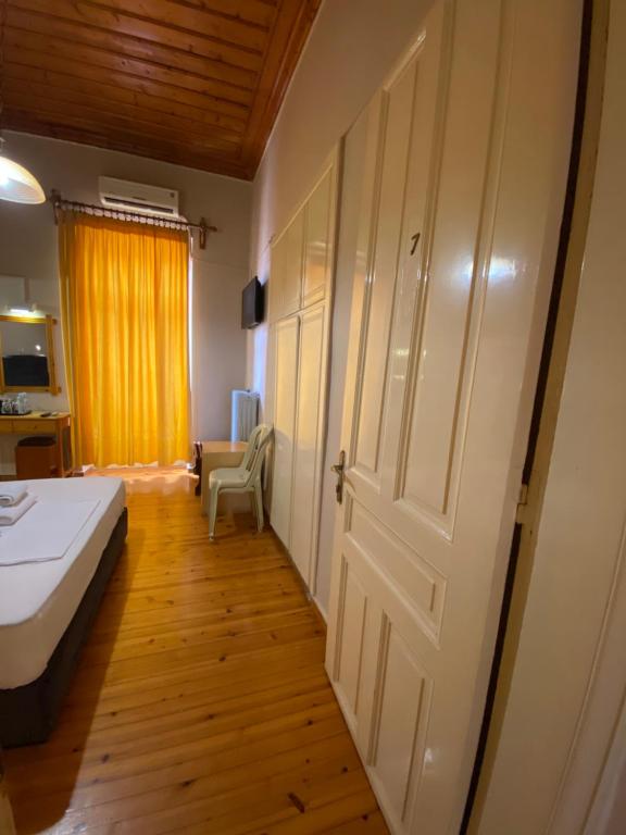 Postel nebo postele na pokoji v ubytování Hotel EPIDAVROS