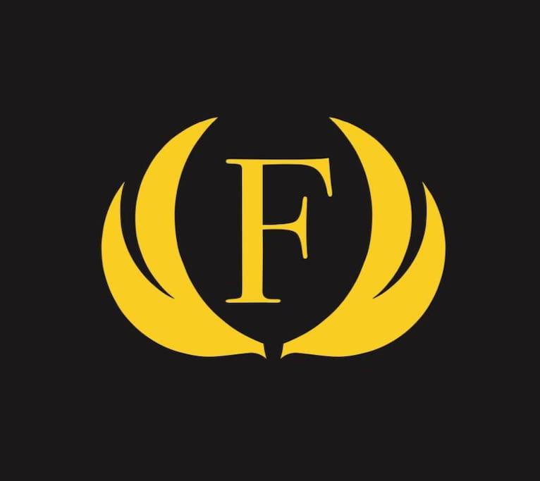 a yellow and black sign with a letterheredarmaarmaarmaarmaarmaarmaarma at Effealatapartments - La Perla della Val di Sole in Dimaro
