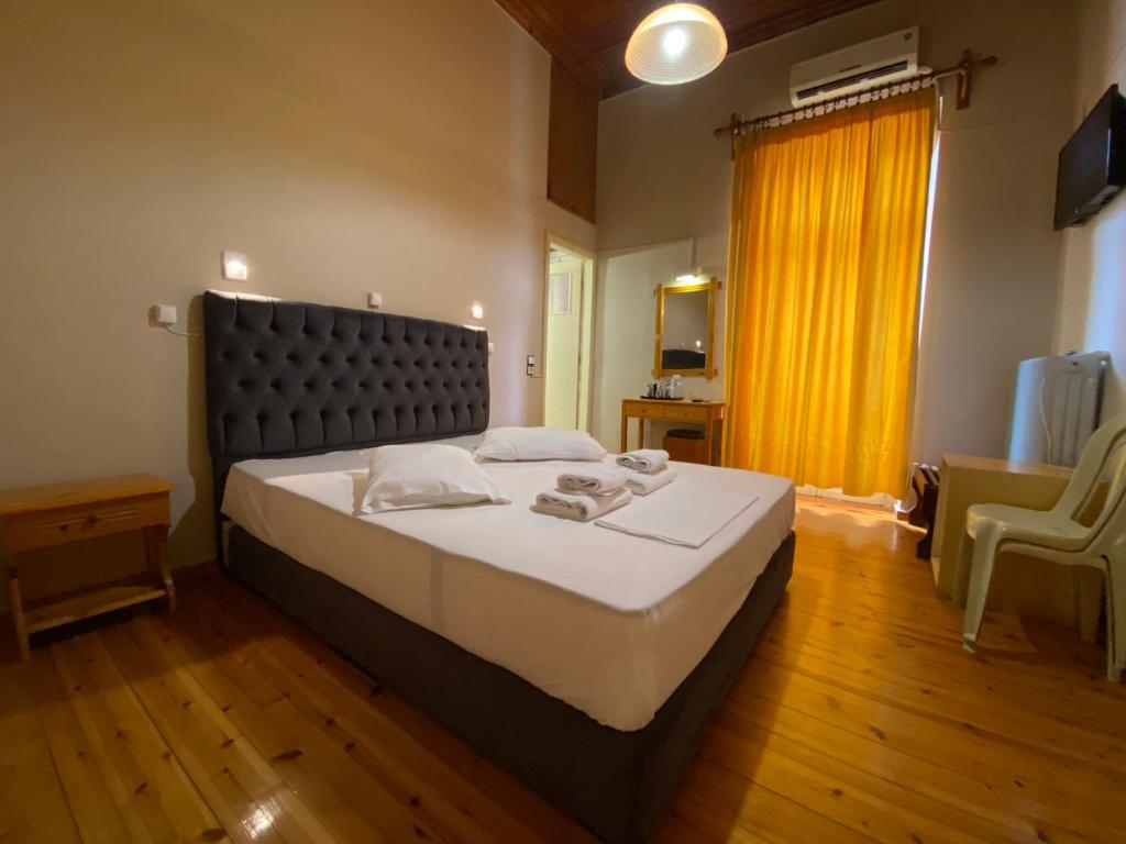 Postel nebo postele na pokoji v ubytování Hotel EPIDAVROS