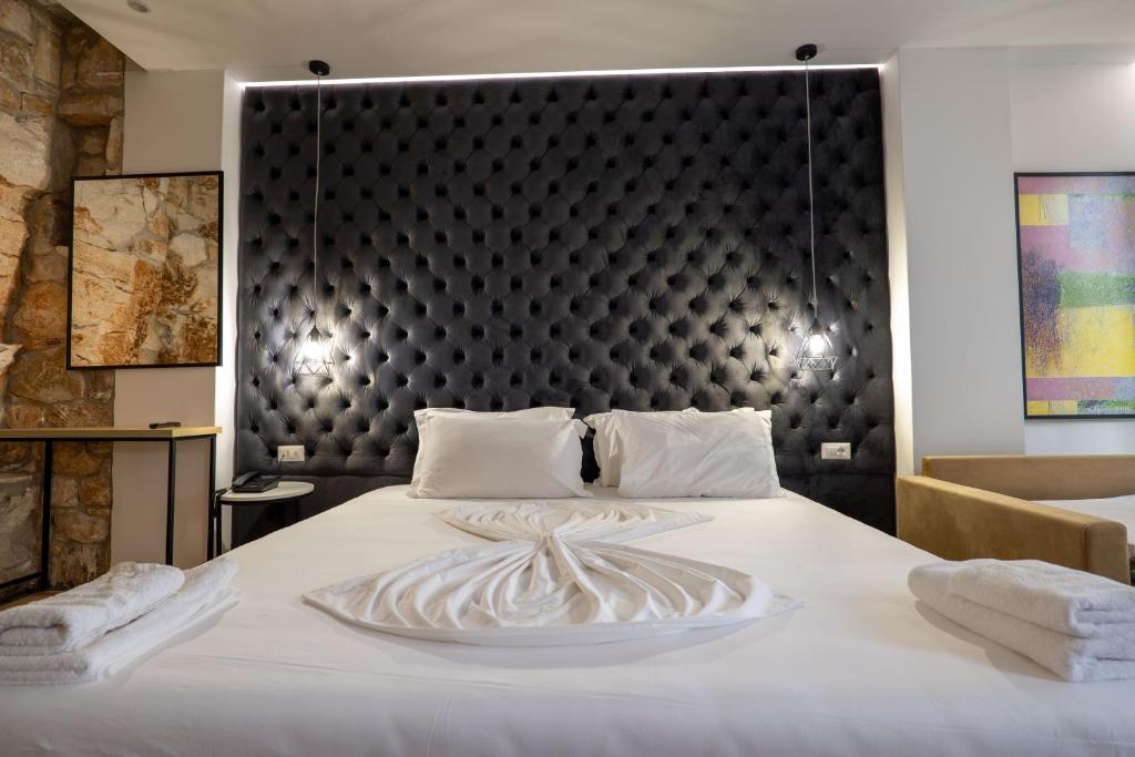 Postel nebo postele na pokoji v ubytování Art Hotel
