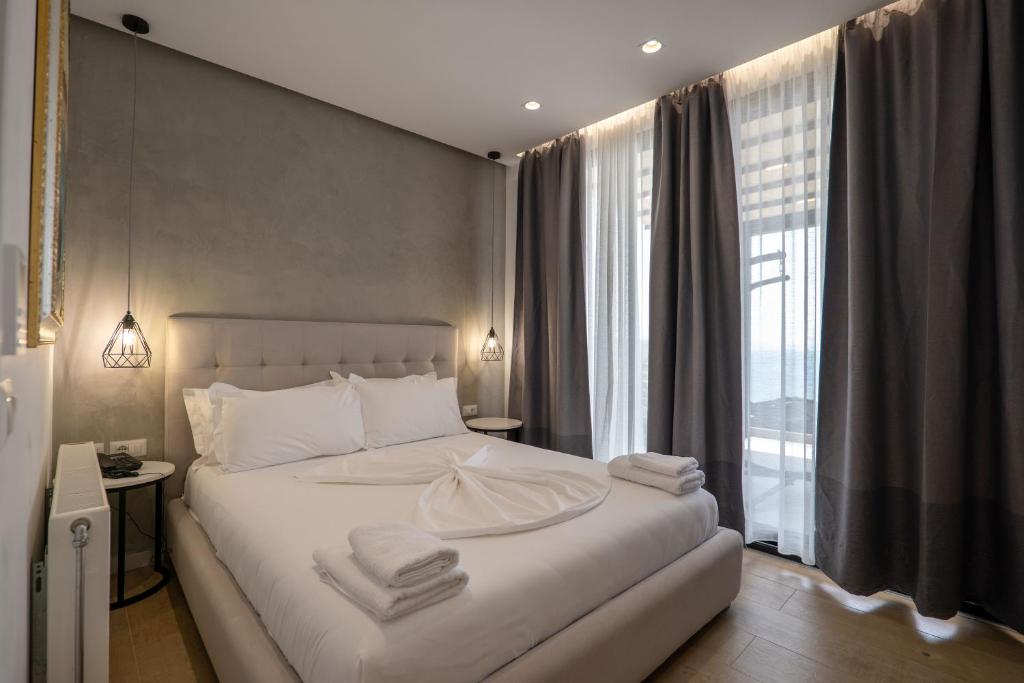 Postel nebo postele na pokoji v ubytování Art Hotel
