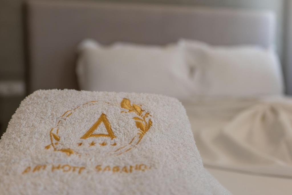 Postel nebo postele na pokoji v ubytování Art Hotel