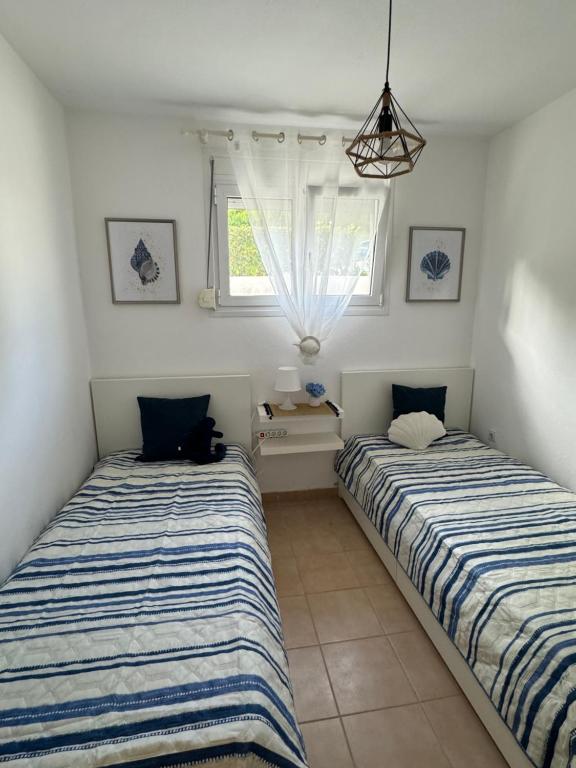 Postel nebo postele na pokoji v ubytování Siviri Holiday Home