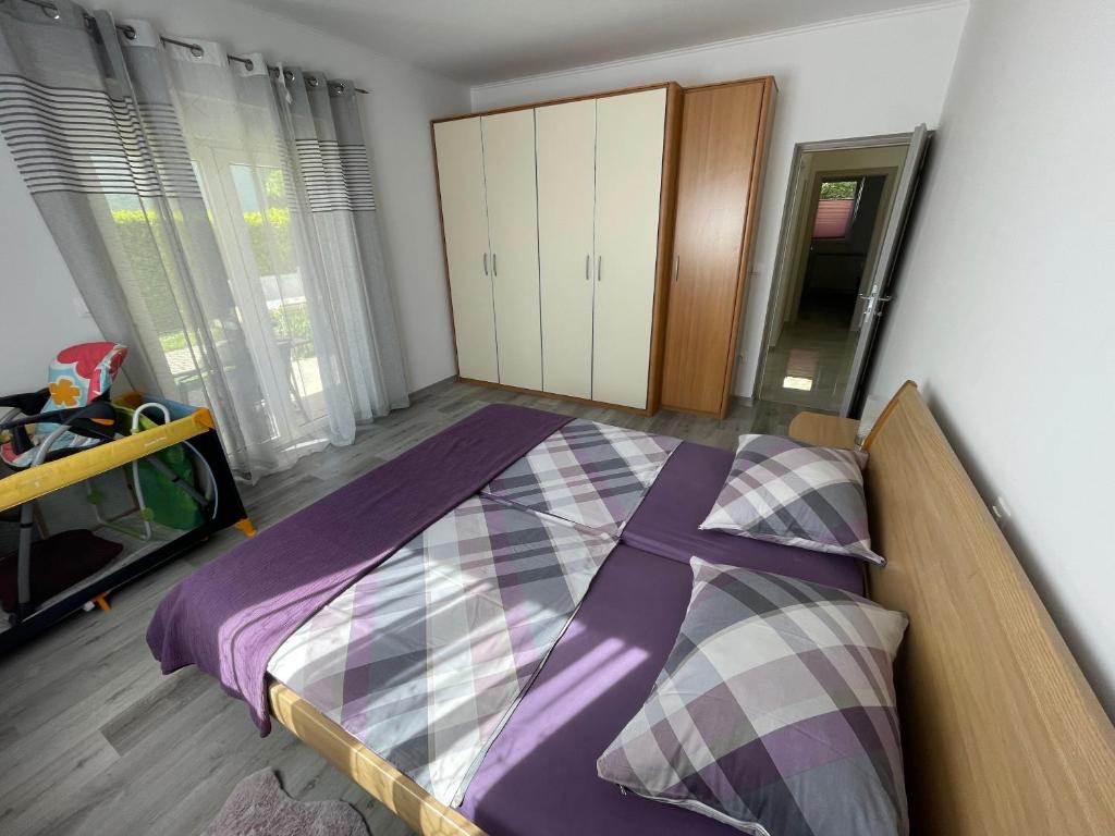Postel nebo postele na pokoji v ubytování Apartments Adria