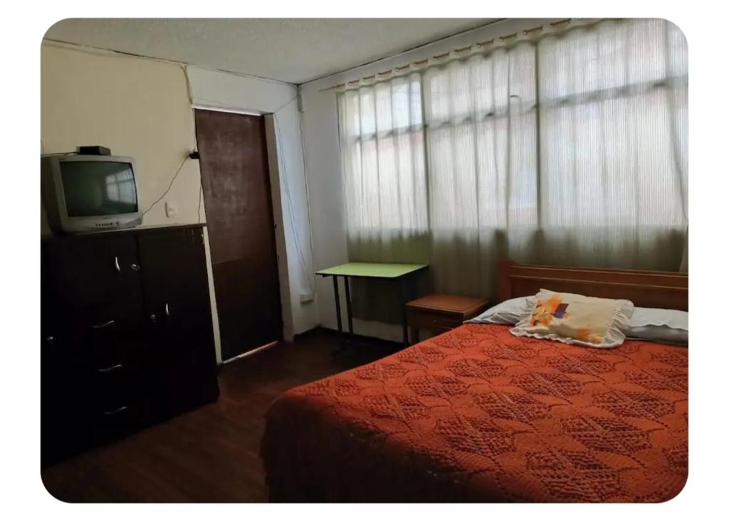 Ένα ή περισσότερα κρεβάτια σε δωμάτιο στο Central Acogedora Casa Hogar