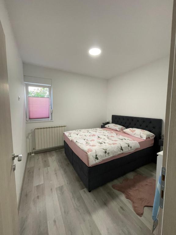 Postel nebo postele na pokoji v ubytování Apartments Adria