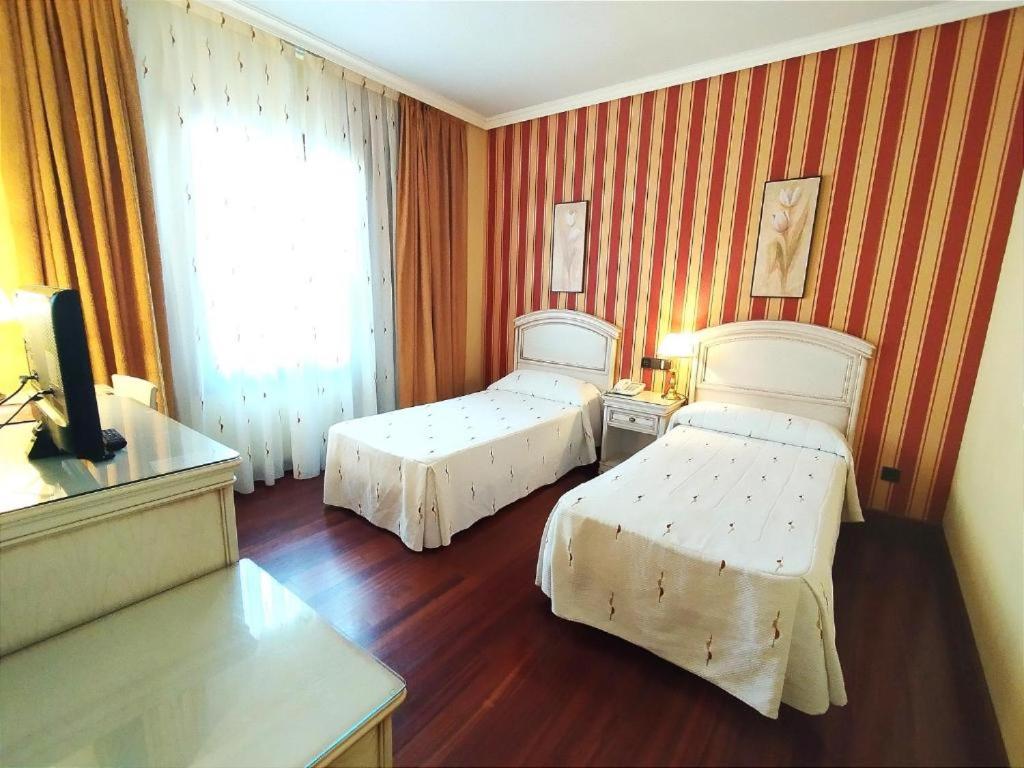 Postel nebo postele na pokoji v ubytování Hotel Conde Ansúrez By Almia Hoteles