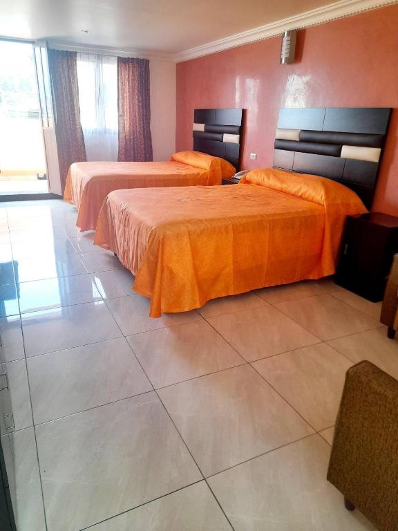 Postel nebo postele na pokoji v ubytování Hotel Posada Del Parque