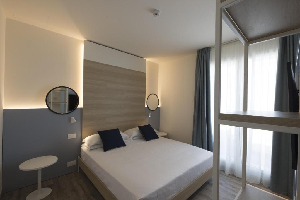 Postel nebo postele na pokoji v ubytování Hotel Baia