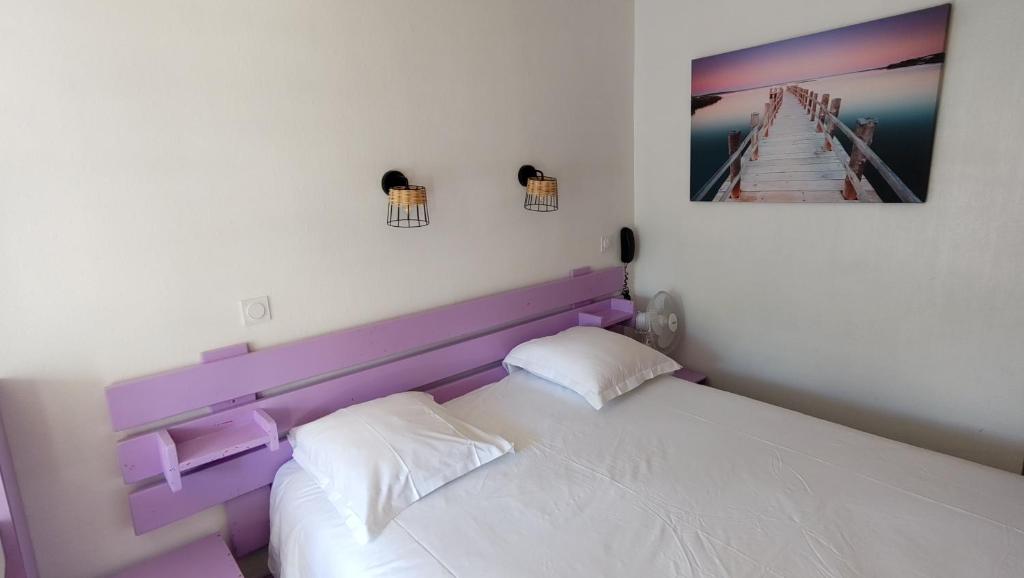 Postel nebo postele na pokoji v ubytování Hotel Le Colibri