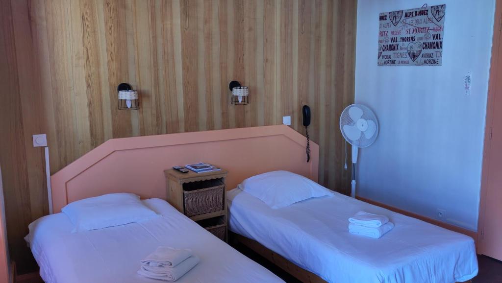 Postel nebo postele na pokoji v ubytování Hotel Le Colibri