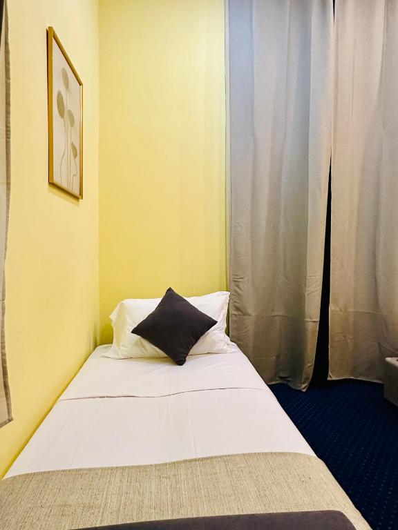 Postel nebo postele na pokoji v ubytování Hotel Rome place