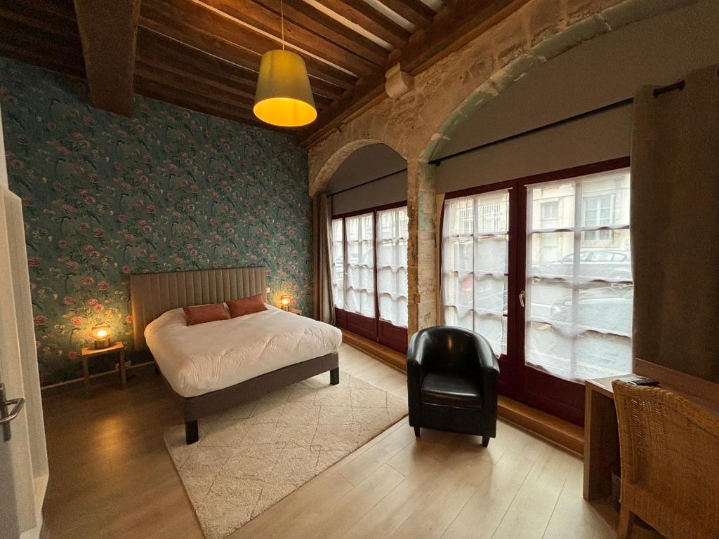 Postel nebo postele na pokoji v ubytování Hotel Le Jacquemart