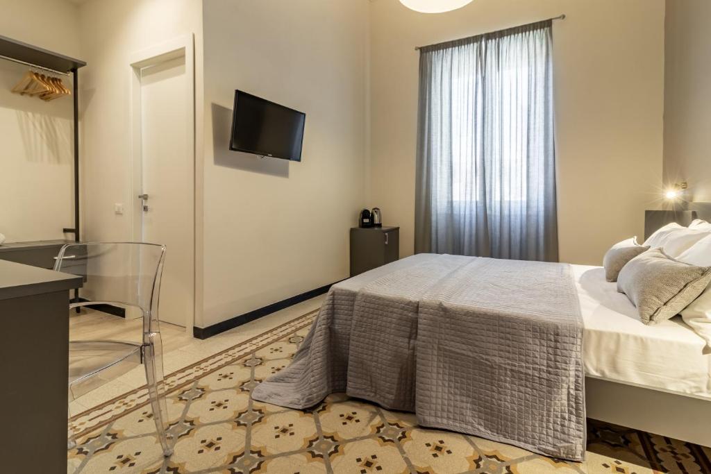 Postel nebo postele na pokoji v ubytování Oldoini Luxury Apartment and Suites