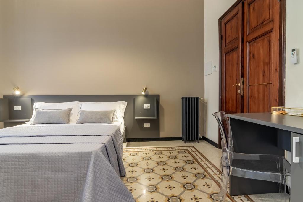 Postel nebo postele na pokoji v ubytování Oldoini Luxury Apartment and Suites