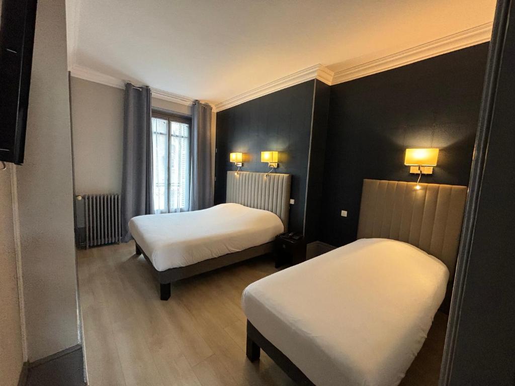 Postel nebo postele na pokoji v ubytování Hotel Le Jacquemart