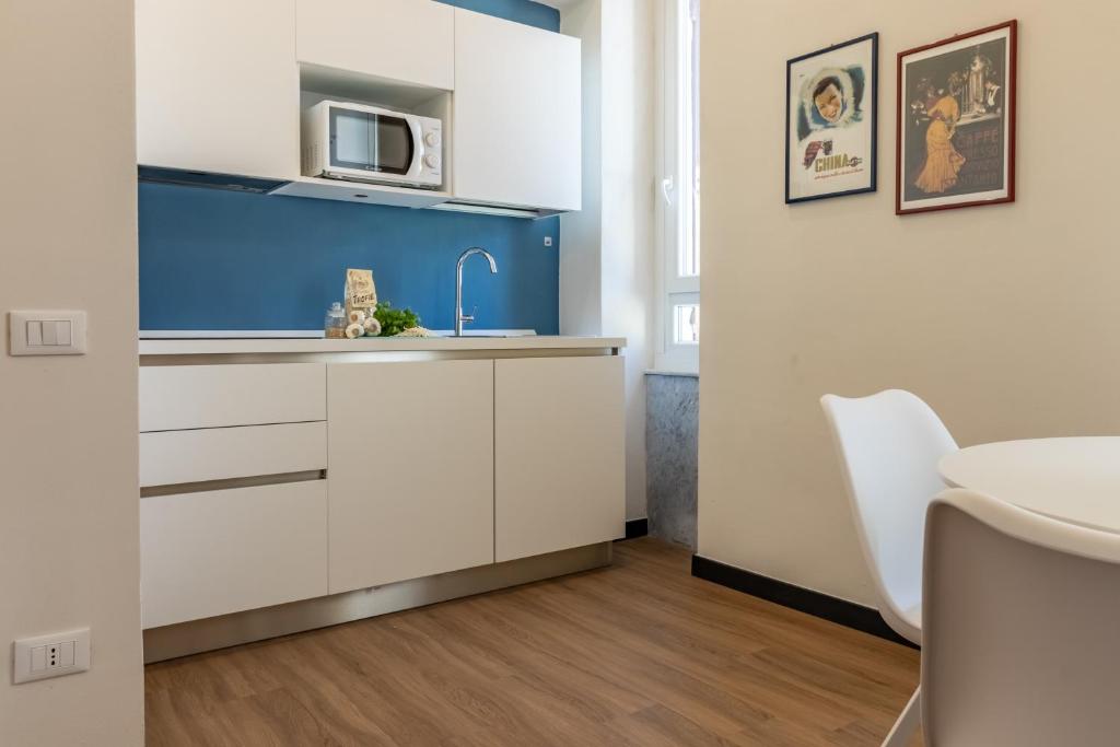 Kuchyň nebo kuchyňský kout v ubytování Oldoini Luxury Apartment and Suites