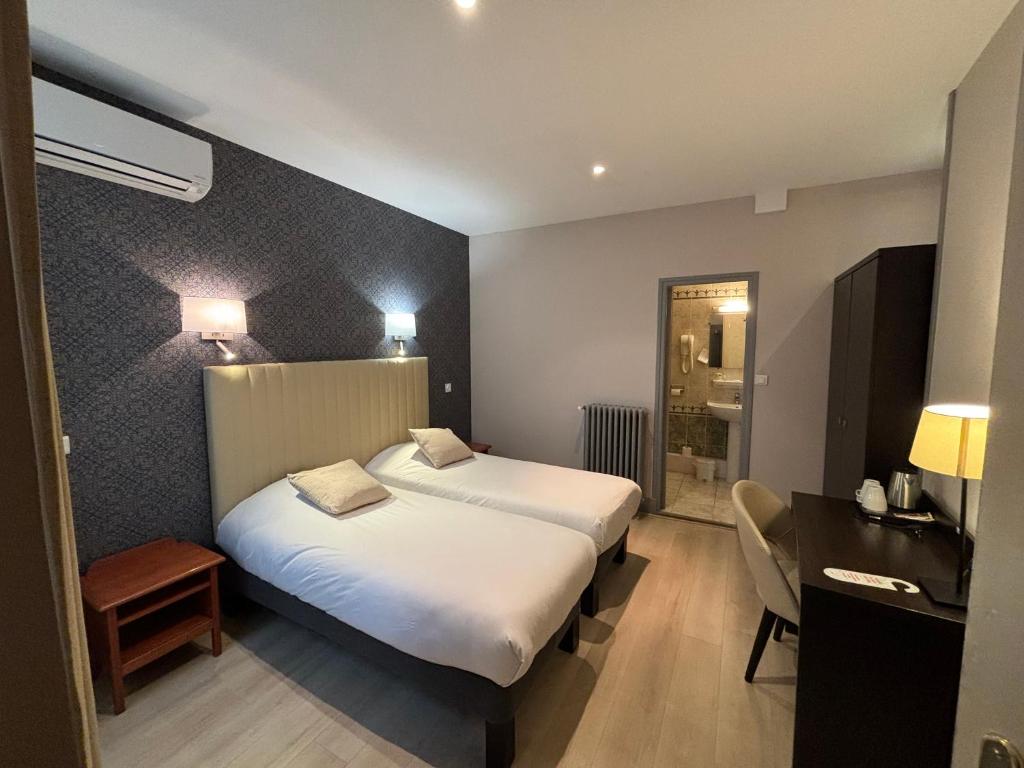 Postel nebo postele na pokoji v ubytování Hotel Le Jacquemart