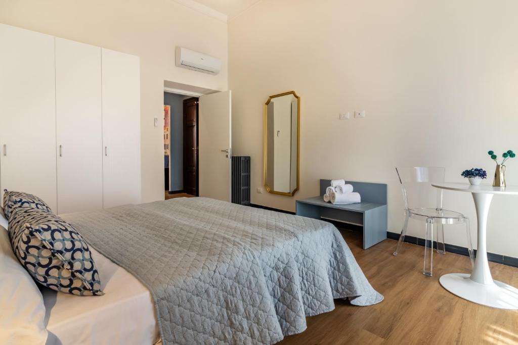 Postel nebo postele na pokoji v ubytování Oldoini Luxury Apartment and Suites