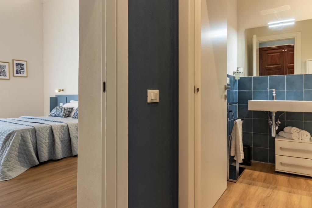 Postel nebo postele na pokoji v ubytování Oldoini Luxury Apartment and Suites